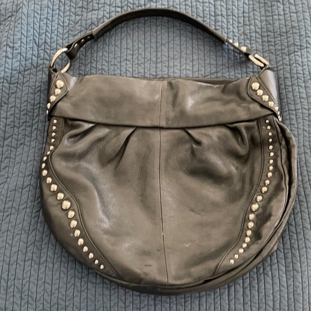 B. Makowsky black leather studded hobo bag.